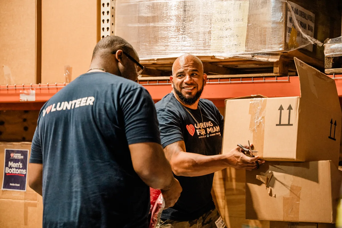 Caring For Miami volunteers serving in the warehouse
